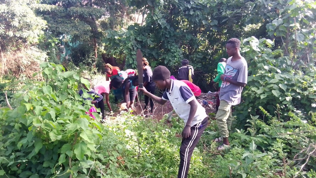 Greenpill Kenya community members working outdoors during a local regenerative activity.