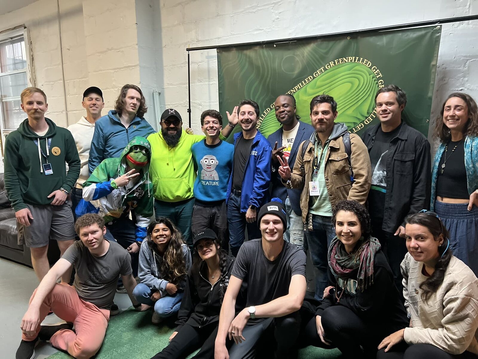 Greenpill NYC meetup participants gathered indoors for a community event.